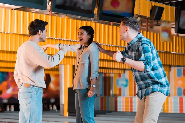 Cheerful African American Girl Pointing Finger Happy Multicultural Friends Bowling — Stock Photo, Image