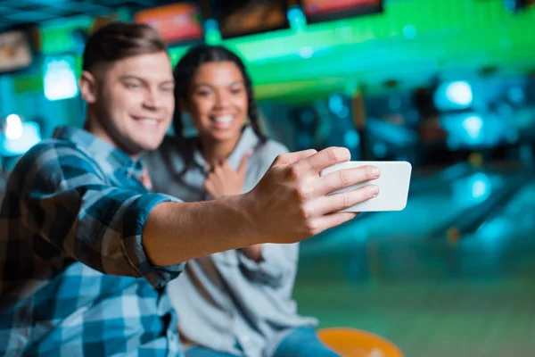 Selective Focus Happy Interracial Couple Taking Selfie Smartphone While Sitting — Stock Photo, Image