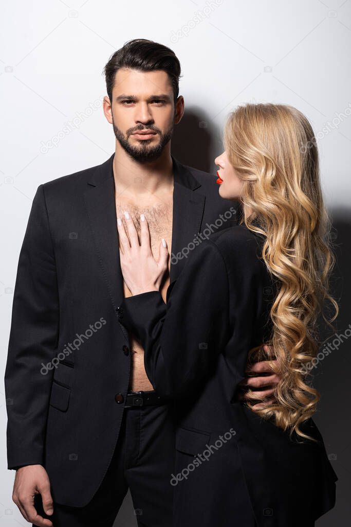 attractive woman looking at handsome man on white 
