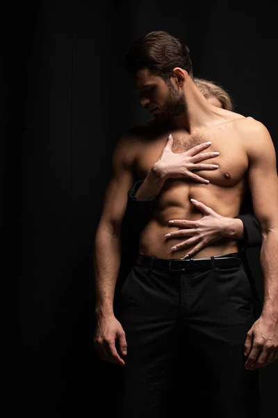 Young Woman Touching Sexy Man Isolated Black — Stock Photo, Image