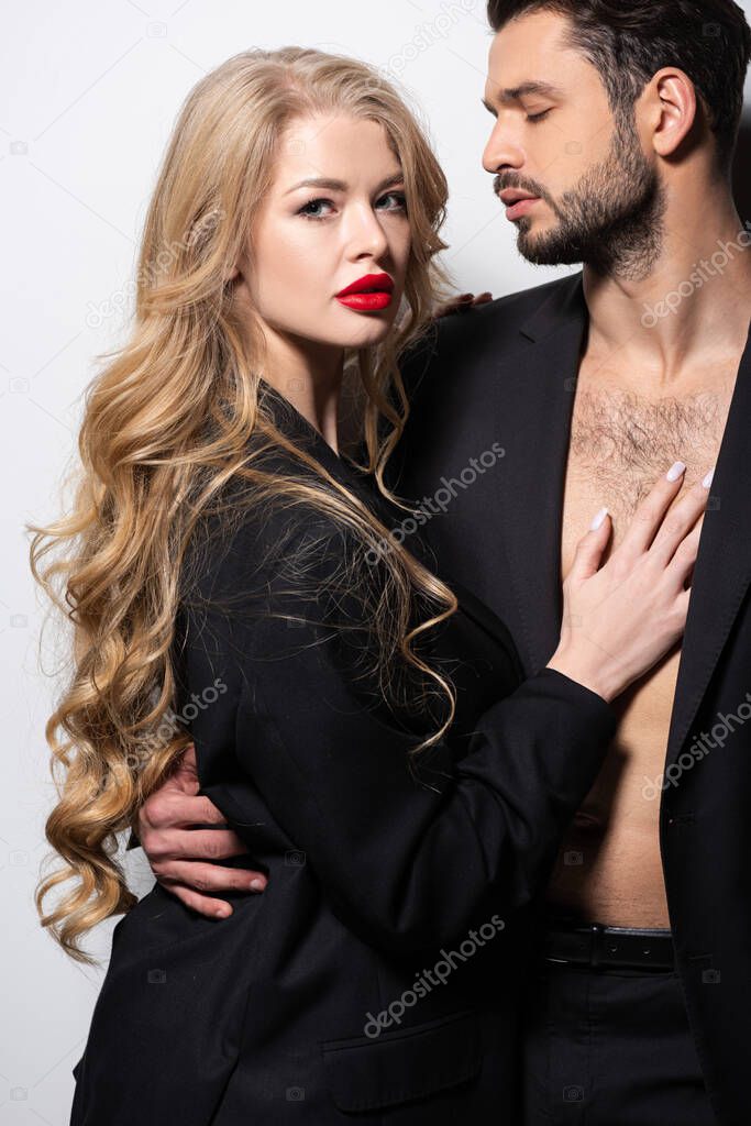 attractive young woman hugging handsome bearded man on white 