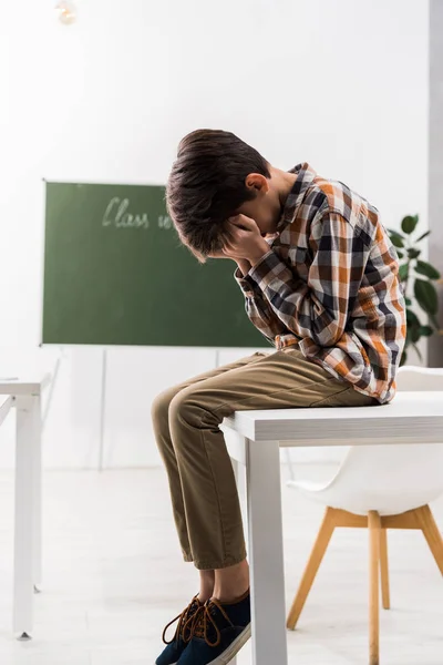 Bullied Schoolchild Covering Face While Crying Classroom — Stock Photo, Image