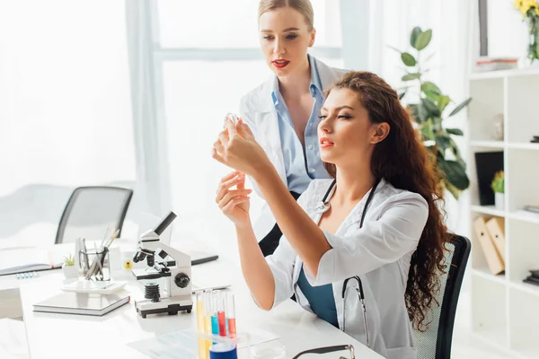 Young Sexy Nurses Looking Test Tube Liquid — Stock Photo, Image