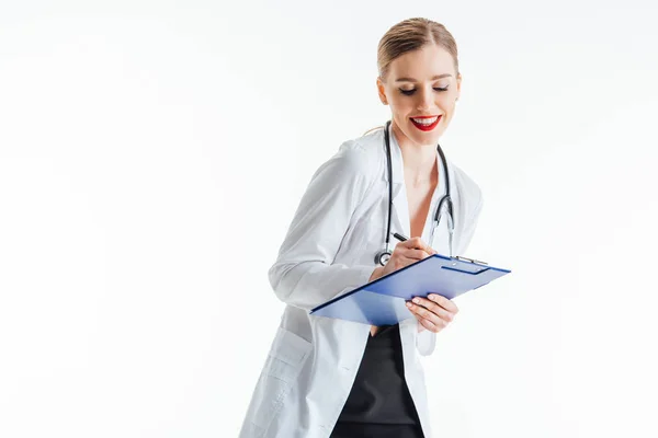 Cheerful Sexy Nurse Writing Prescription While Holding Clipboard Isolated White — Stock Photo, Image
