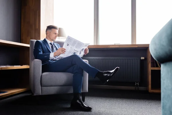 Businessman Suit Sitting Armchair Reading Newspaper Hotel — Stock Photo, Image