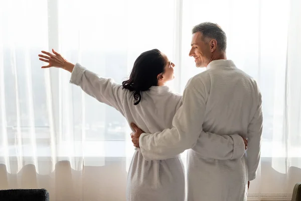 Back View Smiling Boyfriend Girlfriend Bathrobes Hugging Hotel — Stock Photo, Image