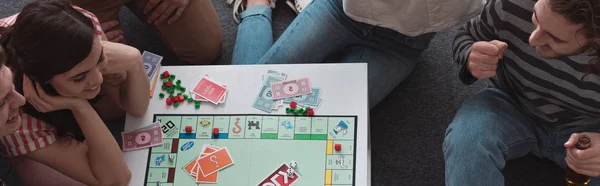 Kyiv Ukraine January 2020 Overhead View Smiling Friends Playing Monopoly — Stock Photo, Image
