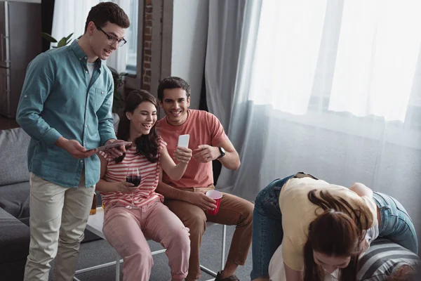 Smiling Girl Taking Photo Cheerful Friends Playing Fun Game Home — Stock Photo, Image