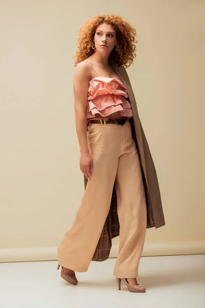 Stylish Redhead Woman Ruffled Top Trousers Walking Beige — Stock Photo, Image