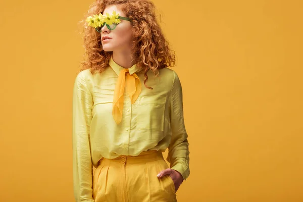Stylish Redhead Woman Sunglasses Flowers Standing Hand Pocket Isolated Yellow — Stock Photo, Image