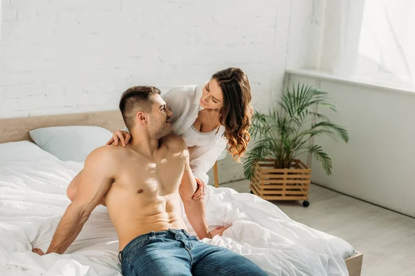 Seductive Girl White Shirt Bralette Hugging Shirtless Sexy Man Sitting — Stock Photo, Image