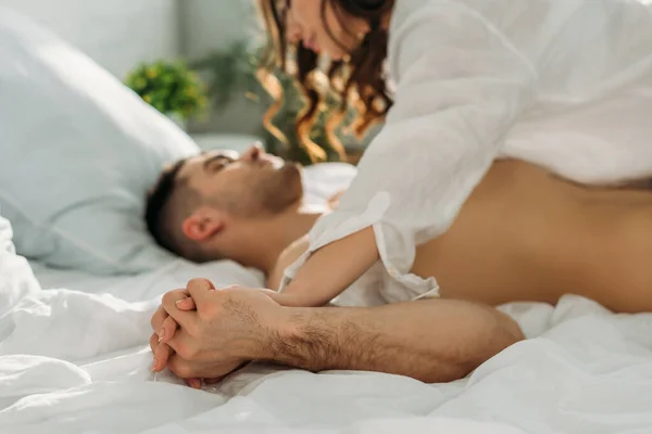 Selective Focus Seductive Girl Holding Hands Sexy Man While Lying — Stock Photo, Image