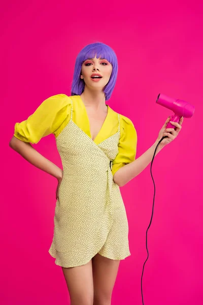 Fashionable Pop Art Girl Purple Wig Using Hair Dryer Isolated — Stock Photo, Image