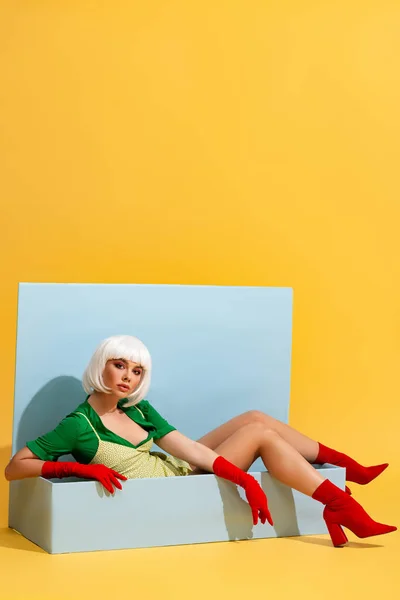 Beautiful Girl White Wig Doll Sitting Blue Box Yellow — Stock Photo, Image