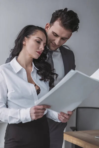 Sexy Secretary Showing Papers Handsome Businessman — Stock Photo, Image