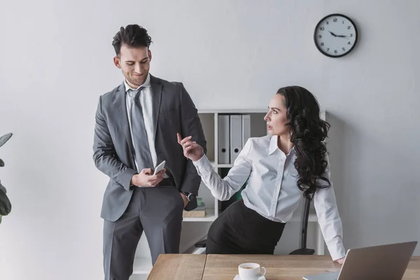 Angry Secretary Showing Indignation Gesture Businessman Taking Her Photo Smartphone — Stock Photo, Image