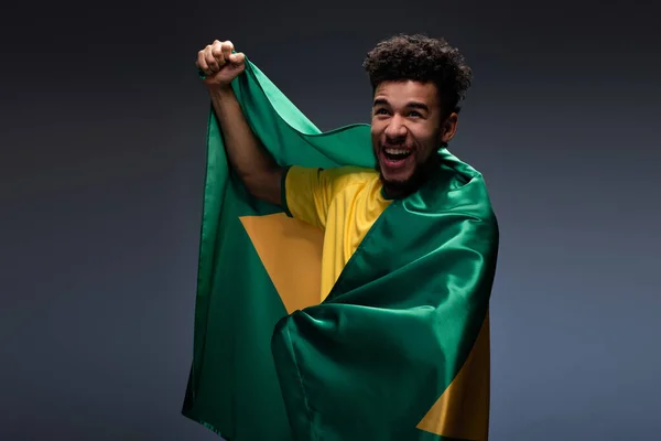 Smiling African American Football Fan Wrapped Brazilian Flag Grey — Stock Photo, Image