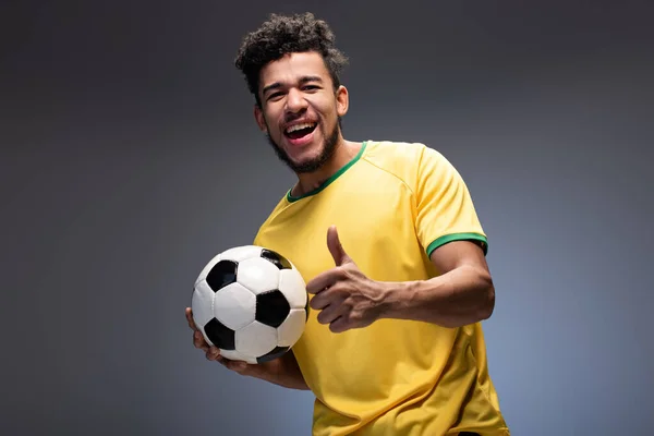 Happy African American Football Fan Yellow Shirt Holding Ball Showing — Stock Photo, Image