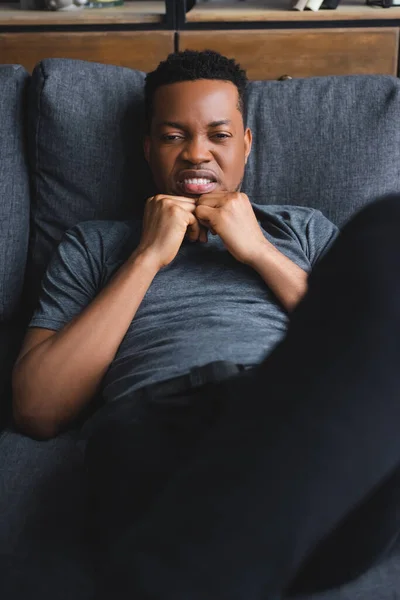 Selective Focus Upset Lonely African American Man Sitting Sofa Home — Stock Photo, Image