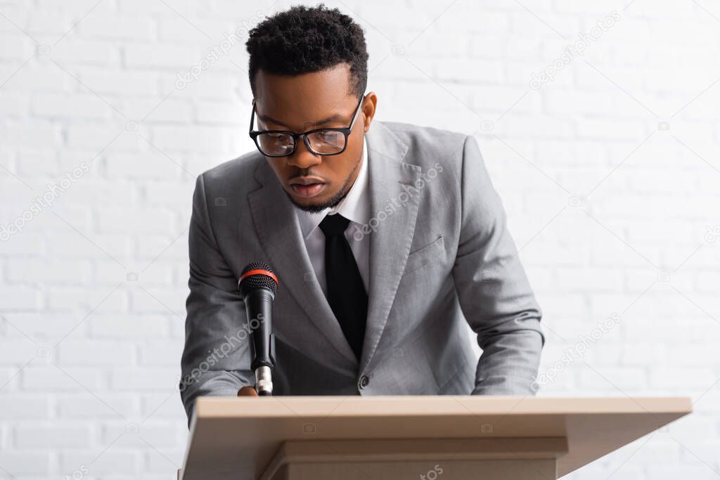 nervous african american speaker on business conference in office