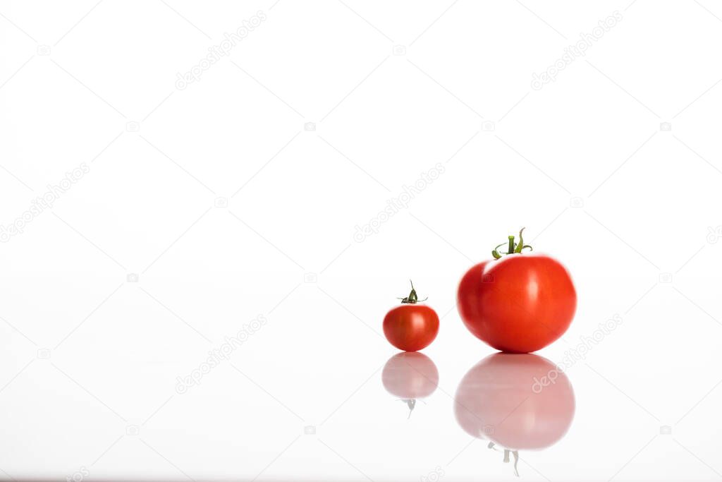 red tomatoes transformation phases on white with copy space 