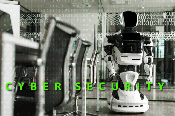 selective focus of humanoid robot standing in conference hall of modern office, cyber security illustration