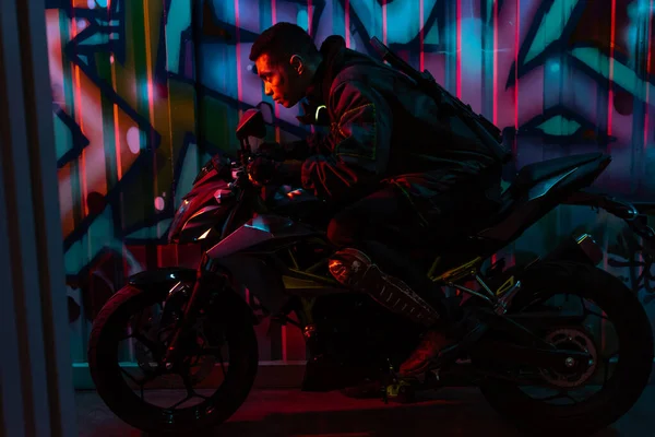 Profile Mixed Race Cyberpunk Player Riding Motorcycle Street Graffiti — Stock Photo, Image