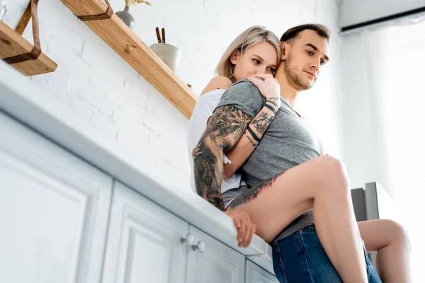 Low Angle View Attractive Girl Hugging Handsome Tattooed Boyfriend Kitchen — Stock Photo, Image