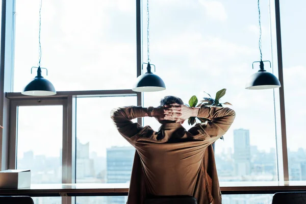 Back View Worker Clenched Hands Chair Table Windows — Stock Photo, Image