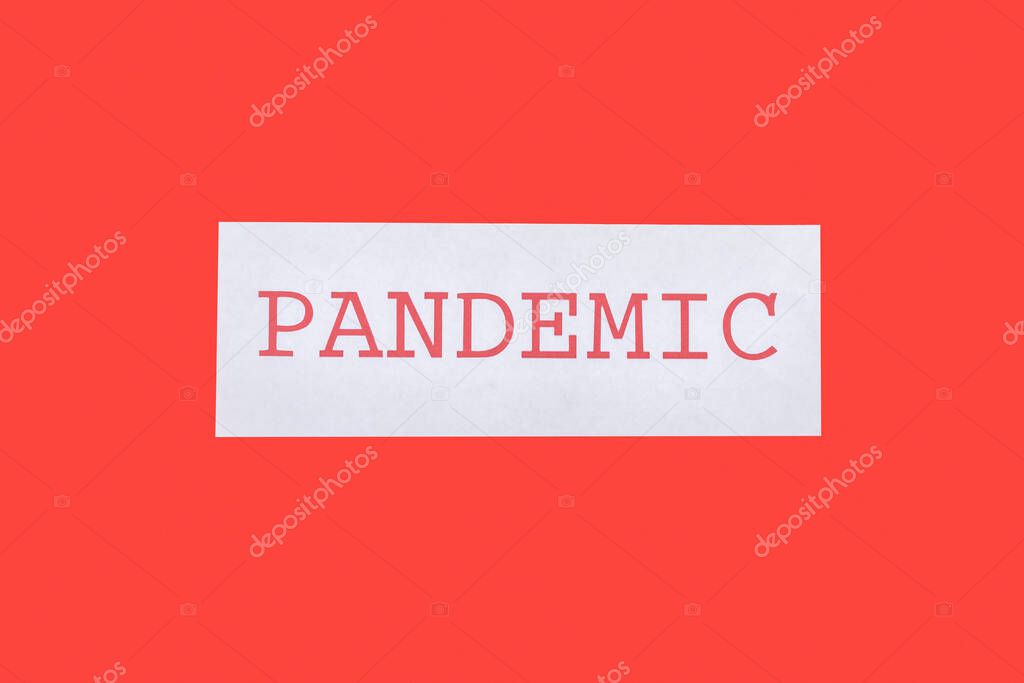 top view of pandemic lettering isolated on red 
