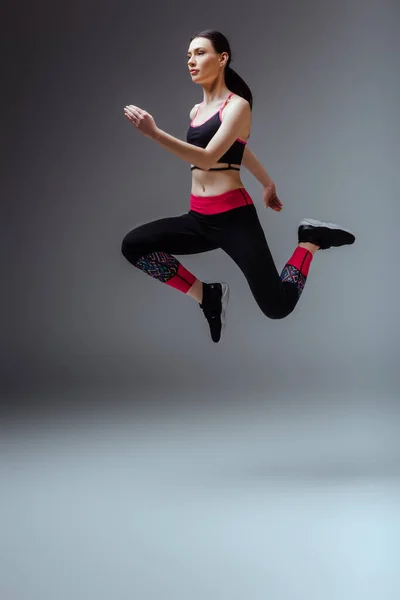 Pretty Sportswoman Sportswear Jumping Grey — Stock Photo, Image