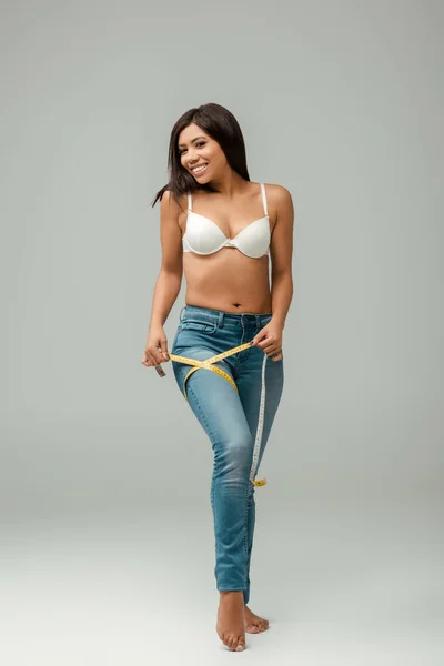 Smiling Overweight African American Girl Jeans Bra Measuring Thigh Grey — Stock Photo, Image