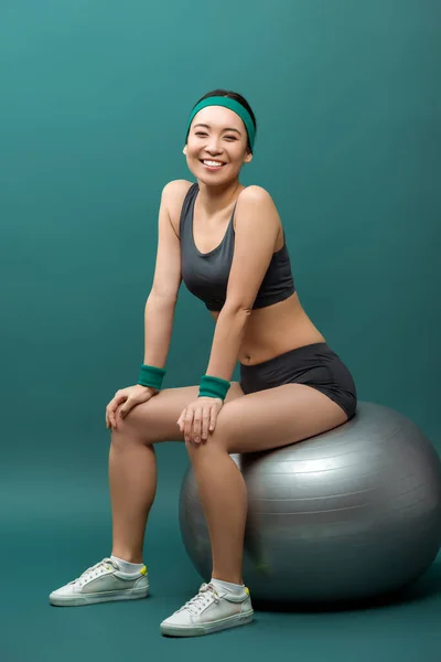 Happy Asian Sportswoman Smiling Looking Camera Fitness Ball Green Background — Stock Photo, Image