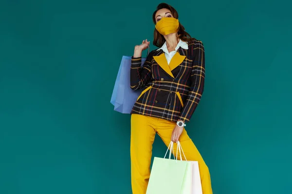 Young Woman Yellow Mask Plaid Blazer Posing Shopping Bags Blue — Stock Photo, Image