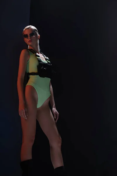 Attractive Stylish Girl Futuristic Leotard Fire Shaped Sunglasses Posing Dark — Stock Photo, Image