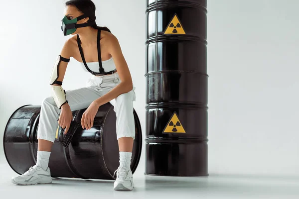 Futuristic African American Woman Safety Mask Gun Radioactive Waste Barrels — Stock Photo, Image