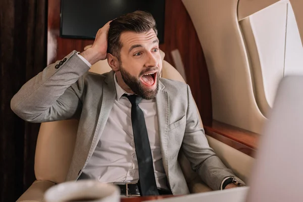 Selective Focus Shocked Businessman Open Mouth Looking Porthole Private Jet — Stock Photo, Image
