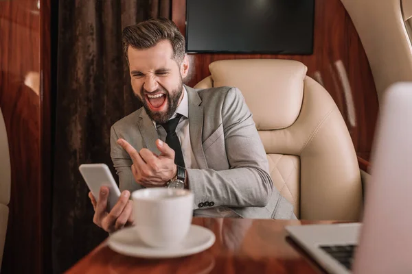 Aggressive Businessman Showing Muddle Finger While Having Video Chat Smartphone — Stock Photo, Image