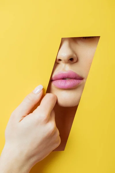 Partial View Woman Pink Lips Touching Yellow Paper — Stock Photo, Image