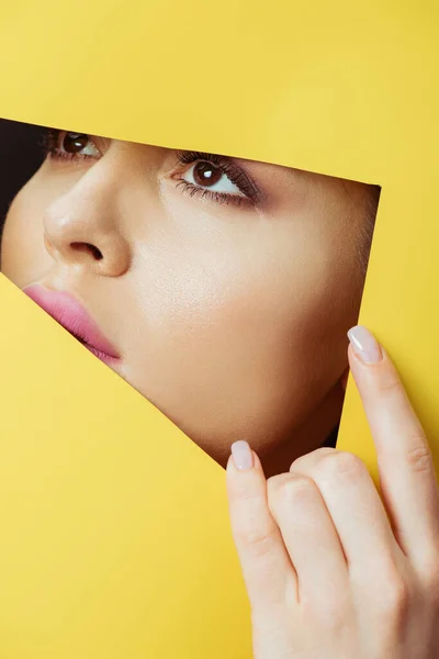 Woman Looking Triangular Hole Touching Yellow Paper — Stock Photo, Image