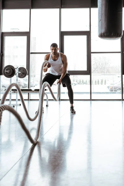 Selective Focus Handsome Sportsman Exercising Battle Ropes Modern Gym — Stock Photo, Image