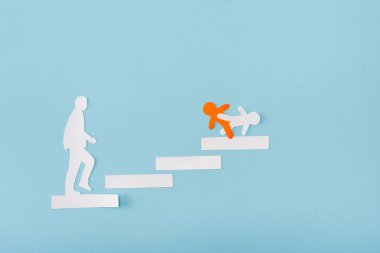 Top view of paper orange and white men on career ladder on blue  clipart