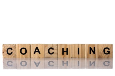 Wooden cubes with coaching lettering on white clipart