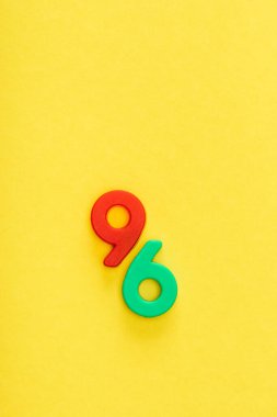 Top view of six and nine numbers on yellow background clipart