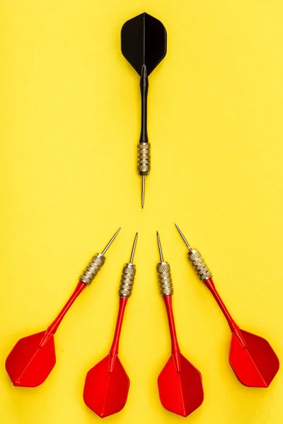 Flat Lay Unique Black Dart Another Red Yellow Background — Stock Photo, Image