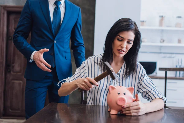 Worried Woman Holding Hammer Piggy Bank Table Collector Outstretched Hand — Stock Photo, Image
