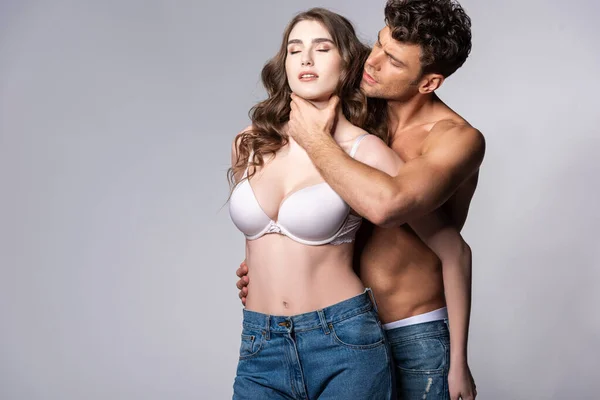 Muscular Man Jeans Touching Neck Girl White Bra Grey — Stock Photo, Image