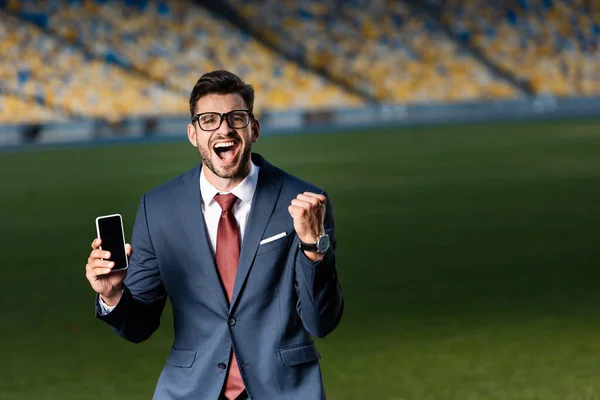 Excited Young Businessman Suit Glasses Holding Smartphone Blank Screen Showing — Stock Photo, Image