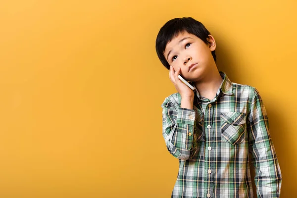 Sad Asian Boy Talking Smartphone Yellow — Photo