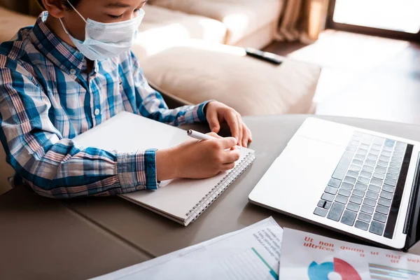 Asian Boy Medical Mask Writing Studying Online Laptop Home Self — Stock Photo, Image